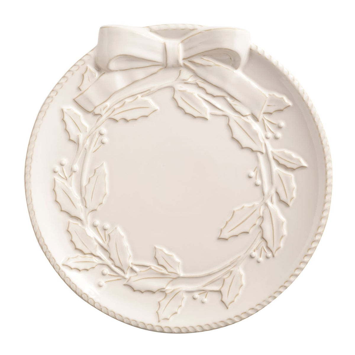 White milk glazed stoneware platter with textured relief and wooden serving tongs.