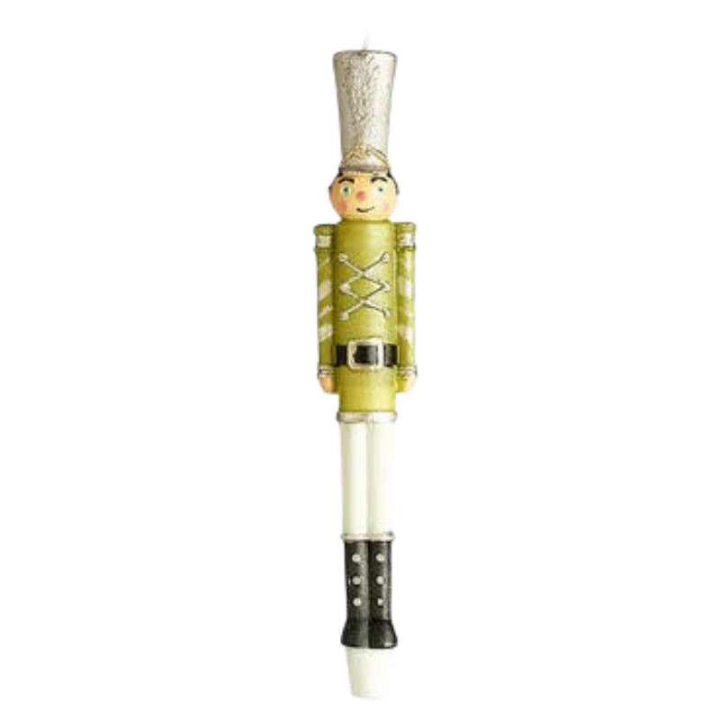 A 10-inch tall nutcracker soldier taper candle with a green uniform and silver hat.
