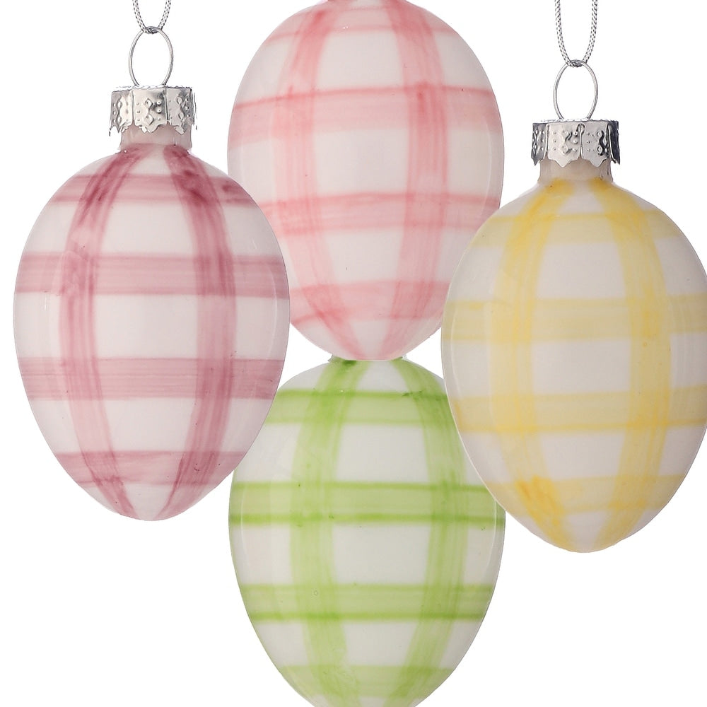 Two-inch glass egg ornament with vertical white stripes on a clear background.