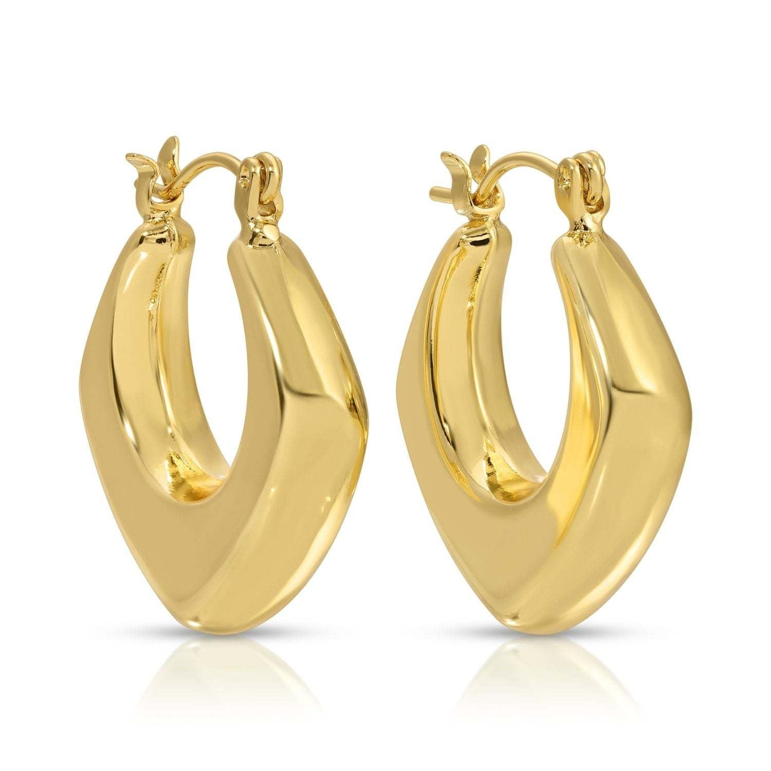 Wide angled latch hook huggie earrings in silver metal with a sleek modern silhouette.