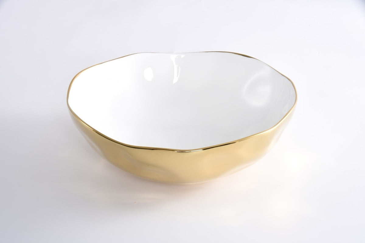 Wide bowl in white high-fired porcelain with gold titanium accents.