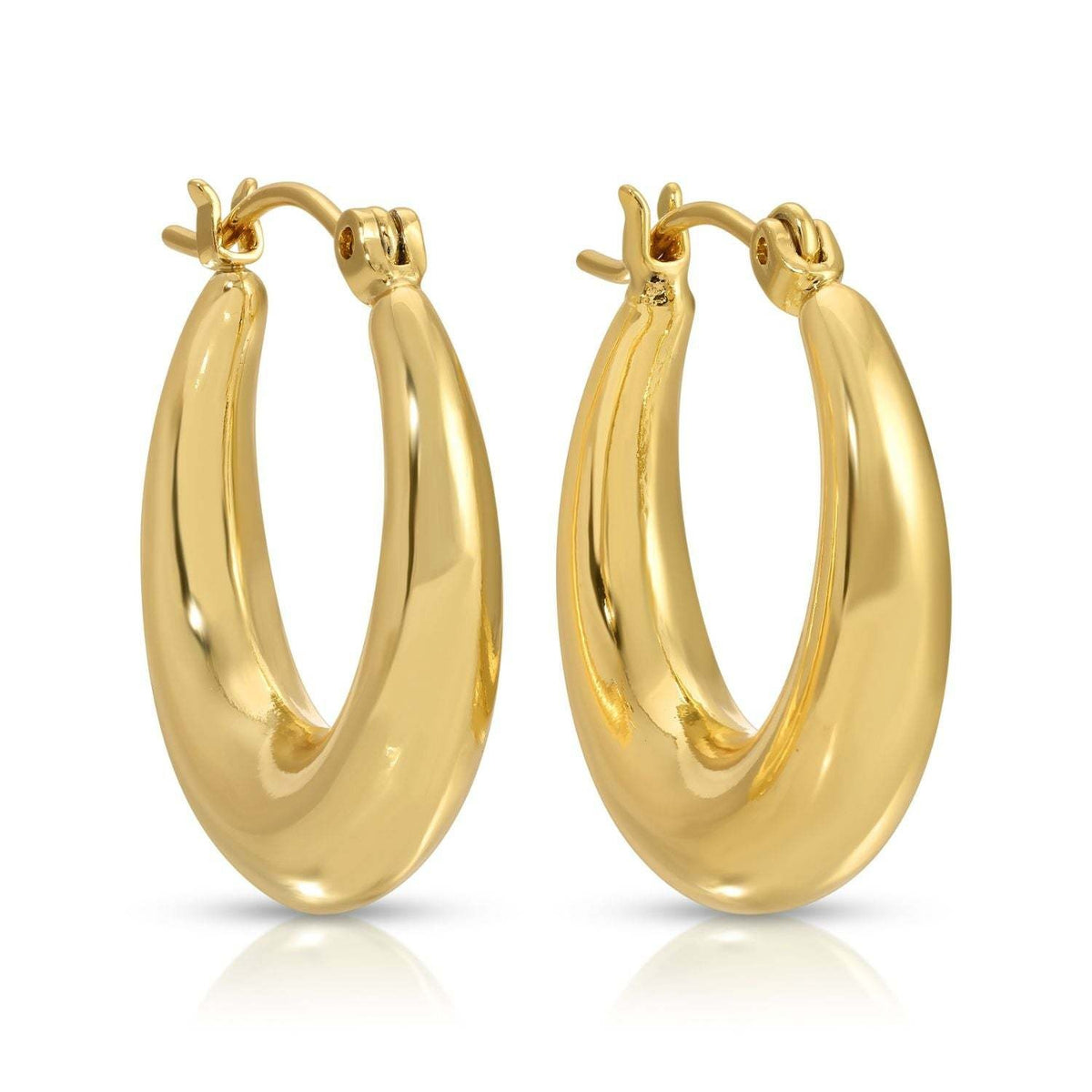 Wide round brass huggie earrings with a secure latch-back closure