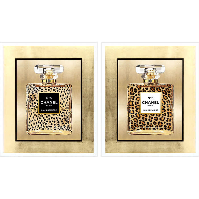 Framed wall art featuring a wild animal print with gold leaf matting in white lacquered shadow box moulding.