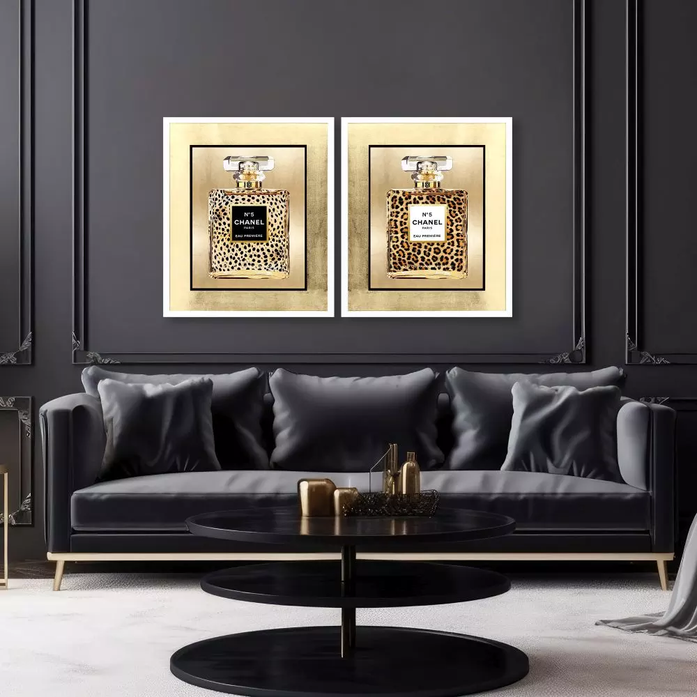 Framed wall art featuring a wild animal print with hand-applied gold leaf matting in white lacquered shadow box moulding.