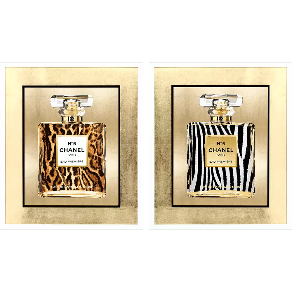 Framed wall art featuring a wild animal print with hand-applied gold leaf matting in lacquered white wood.