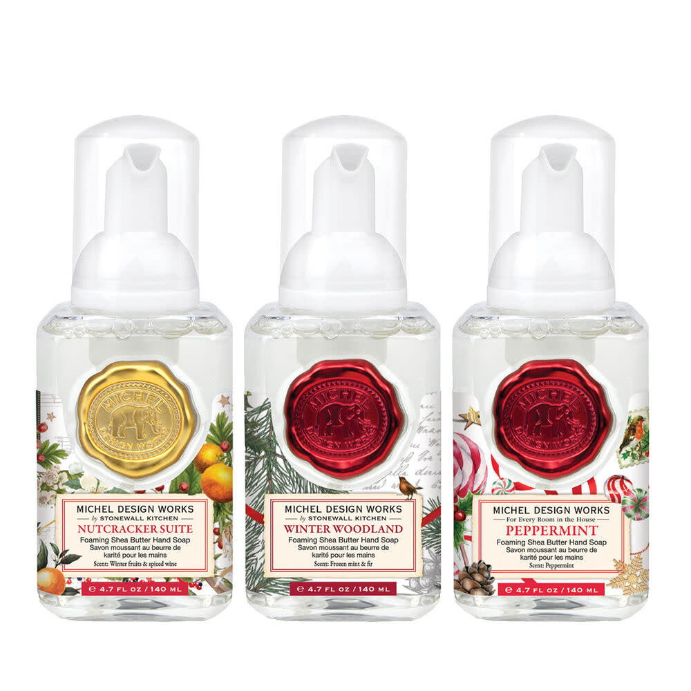 Set of three mini foaming soap dispensers in complementary winter-themed designs.