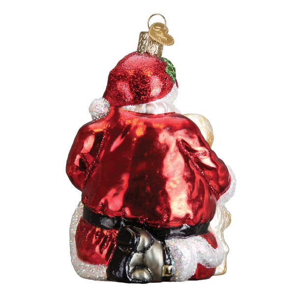 Back view of a glass Santa's Puppy Love ornament featuring a red glittery suit and white trim.
