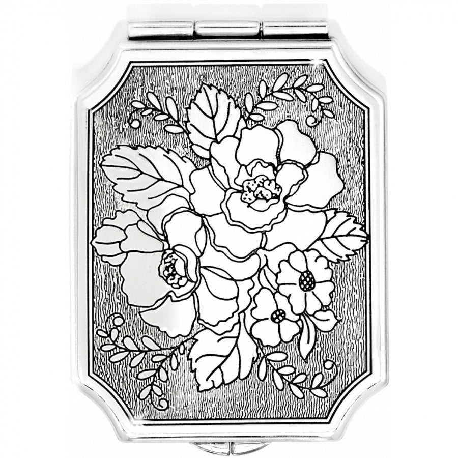 Silver plated compact tapestry with French clip closure offering one side at 2.5 magnification.