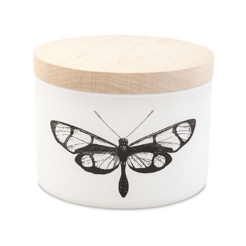 Matte white triple-wick citronella candle with maple wood lid featuring a silk-screened graphic design.