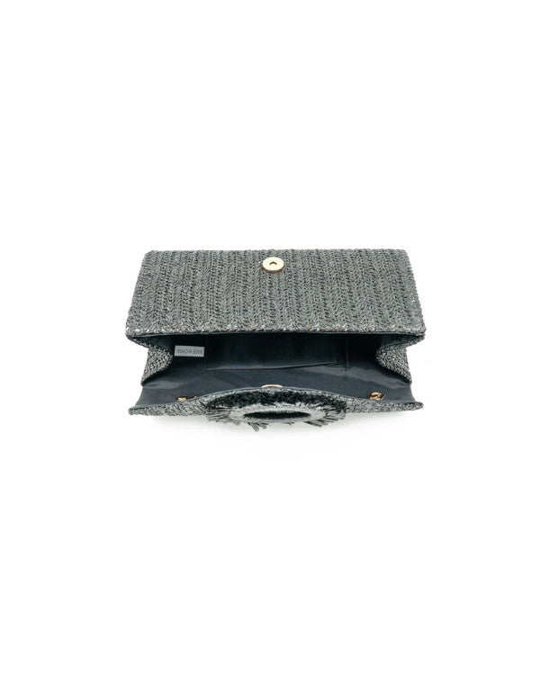 Woven straw Solea clutch bag with natural texture in a rectangular shape.