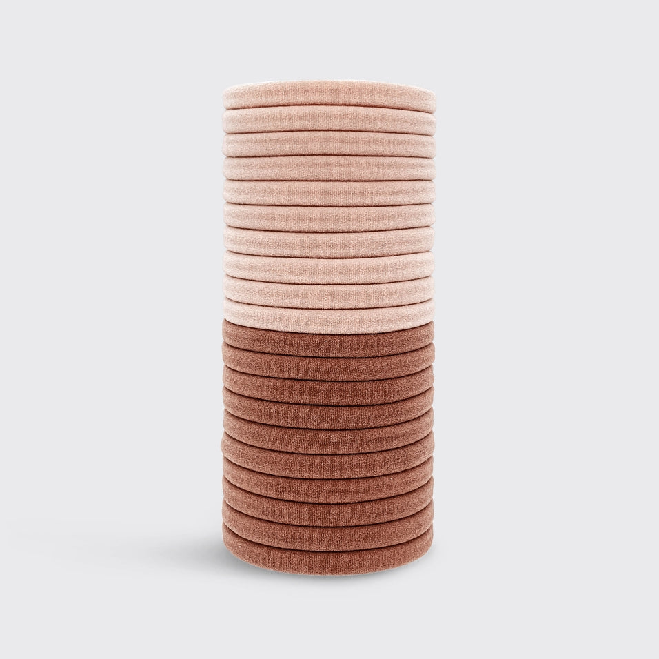 Stack of 20 eco-friendly nylon hair elastics in light peach and terracotta brown colors.
