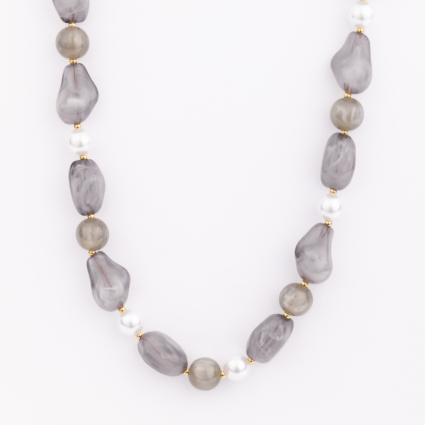 Zoe Necklace featuring chunky grey resin beads, white pearls, and gold-plated metal accents.