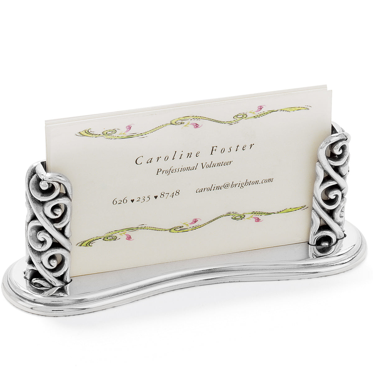 Silver plated business card holder with ornate scrollwork sides and a curved base.
