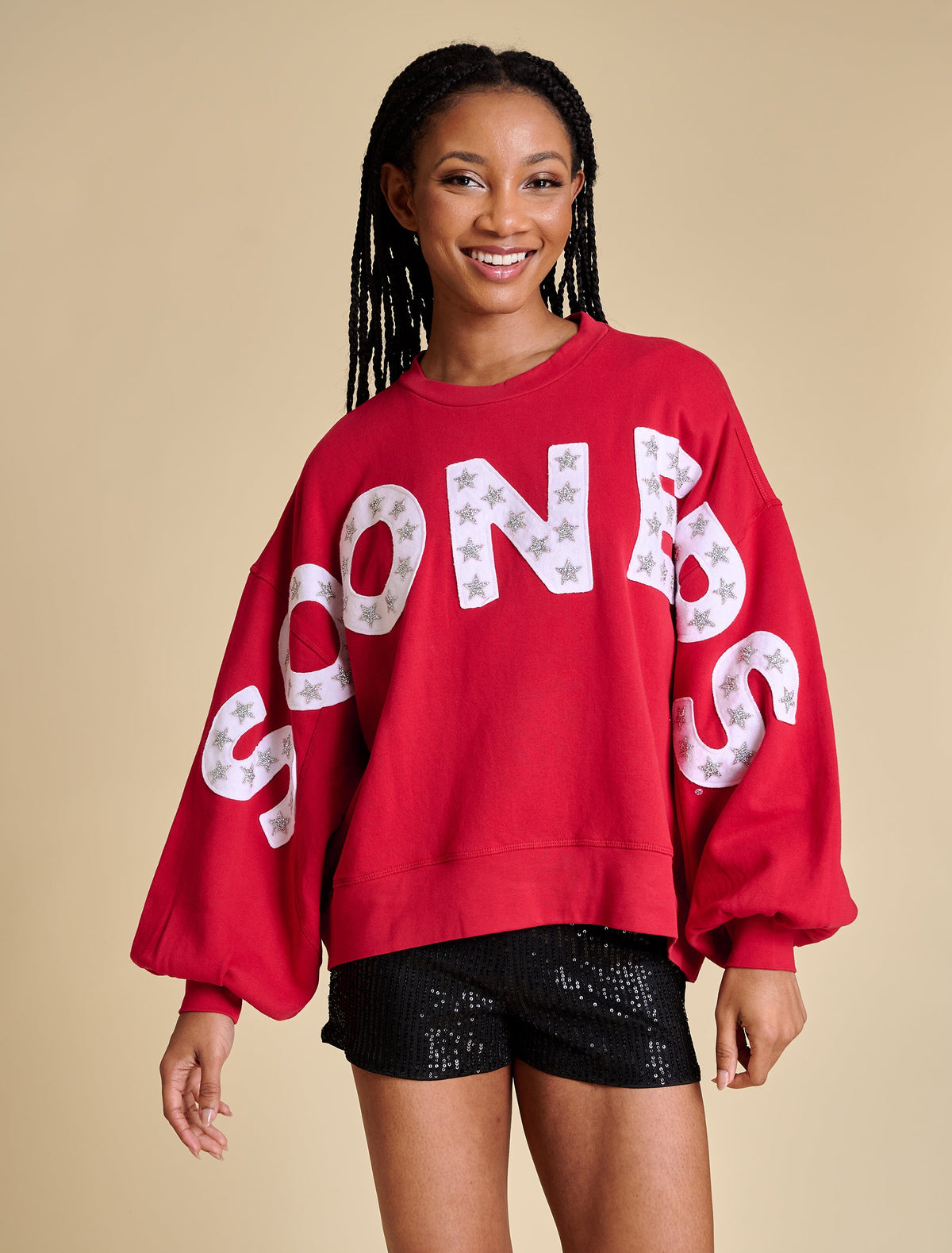 Relaxed fit pullover with voluminous balloon sleeves in a soft neutral tone.