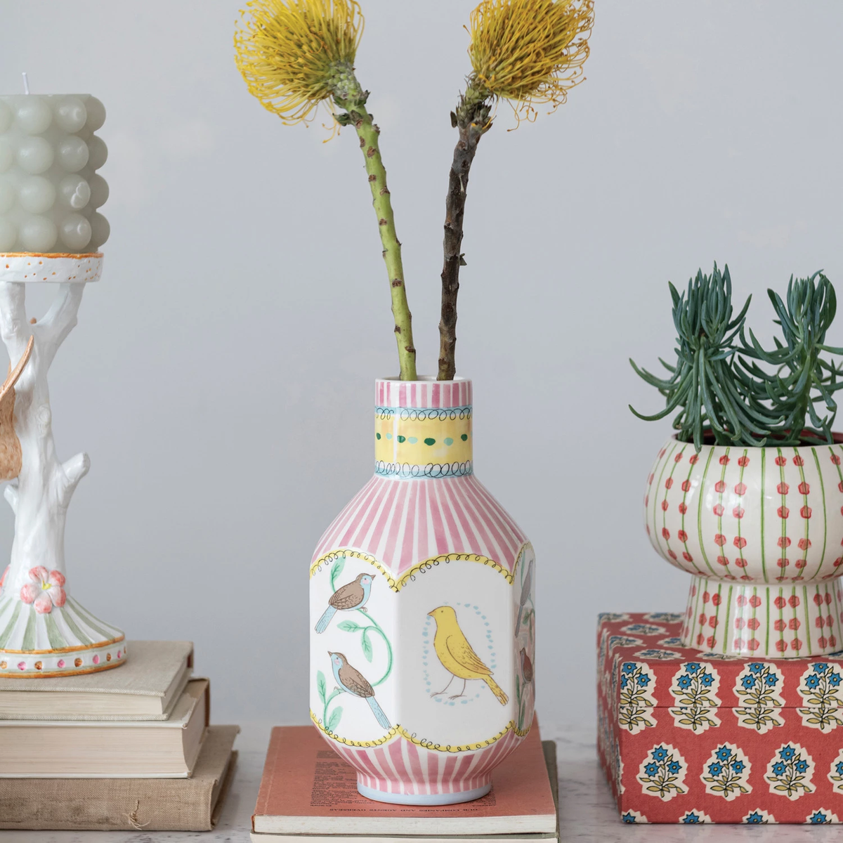 Tall ceramic vase in dolomite featuring a bird motif with organic curves.