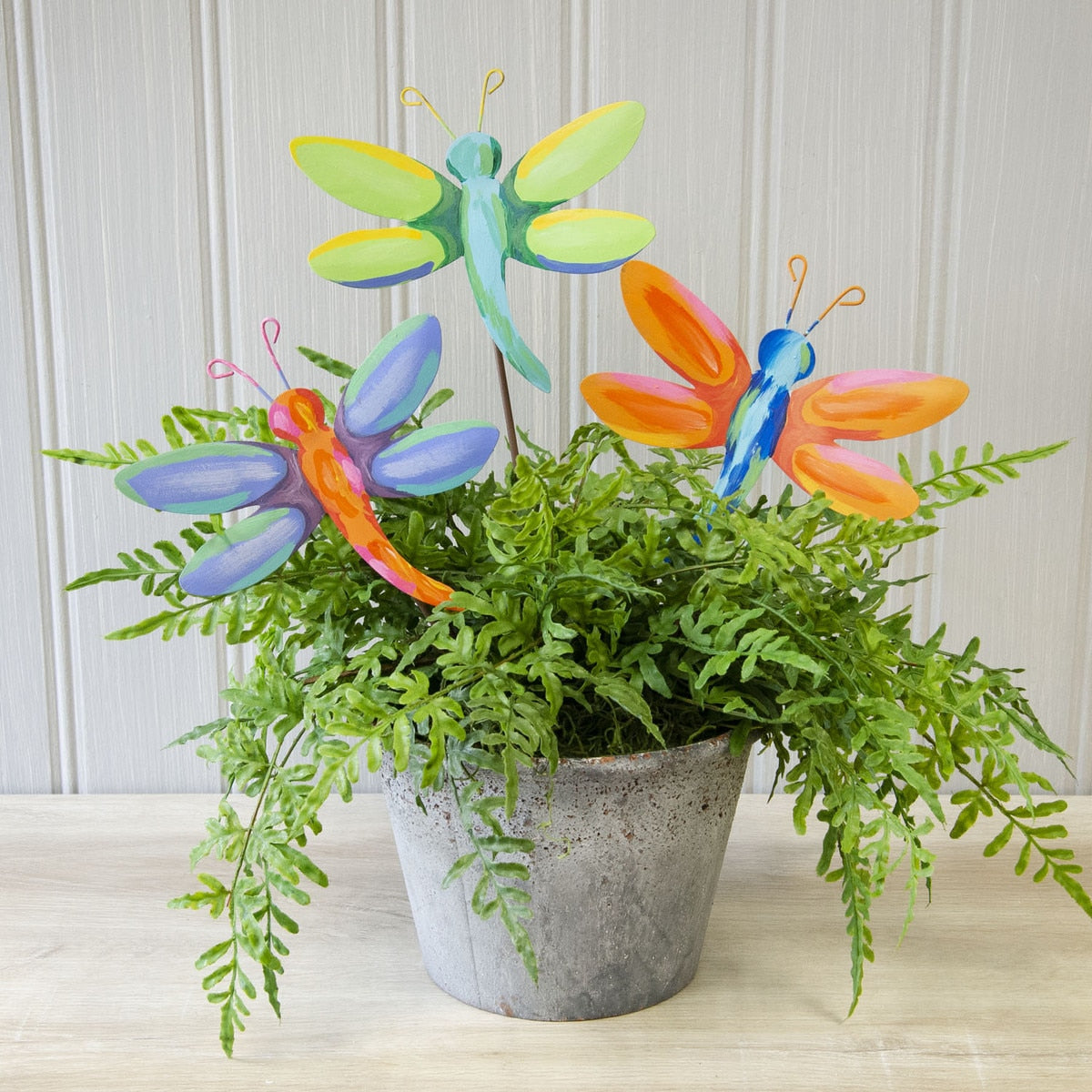 Artful Dragonflies metal garden stake featuring a dragonfly silhouette in blue enamel with gold accents.