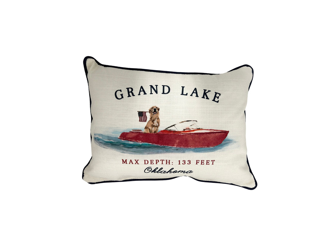 Grand Lake Oklahoma pillow featuring a dog in a red boat with an American flag.