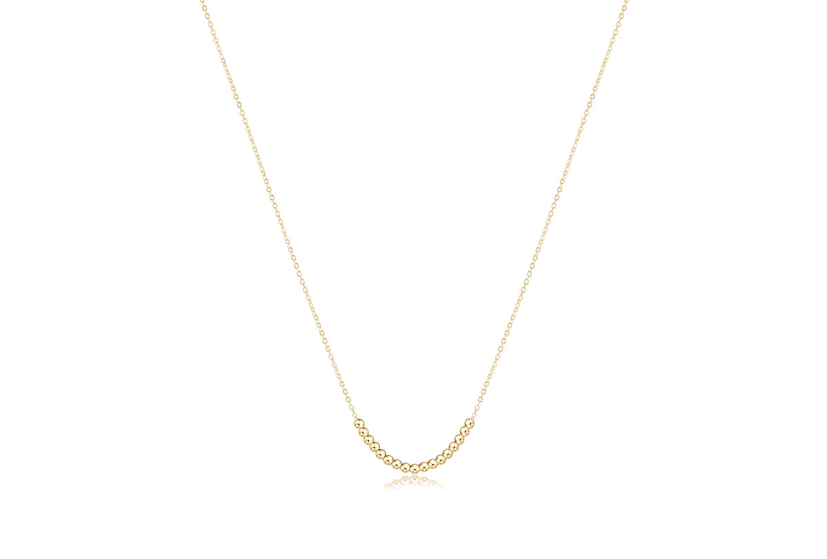 16 inch 14kt gold-filled necklace featuring a delicate chain and a row of 2.5mm gold beads.