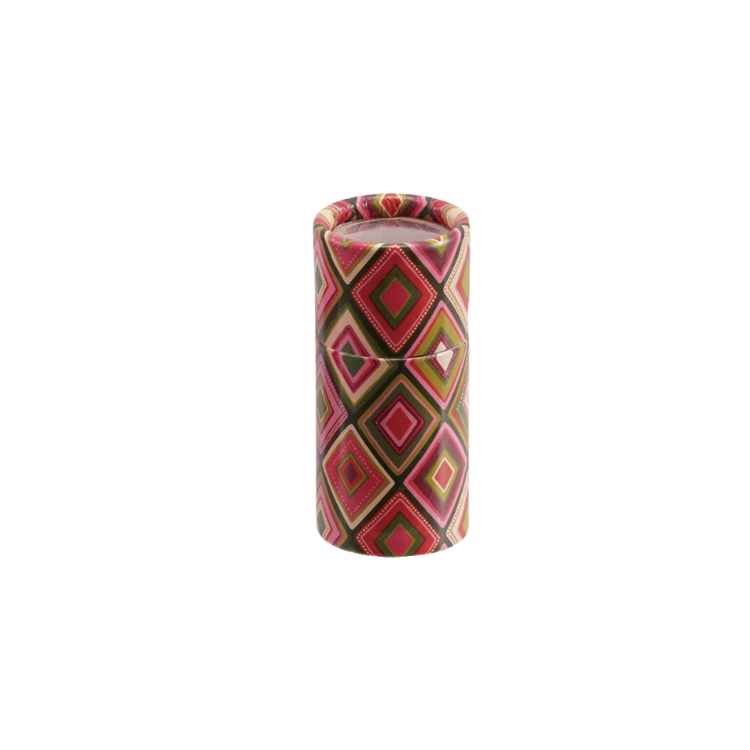 Multicolor paper tube matchbox with a pink and green diamond holiday pattern.