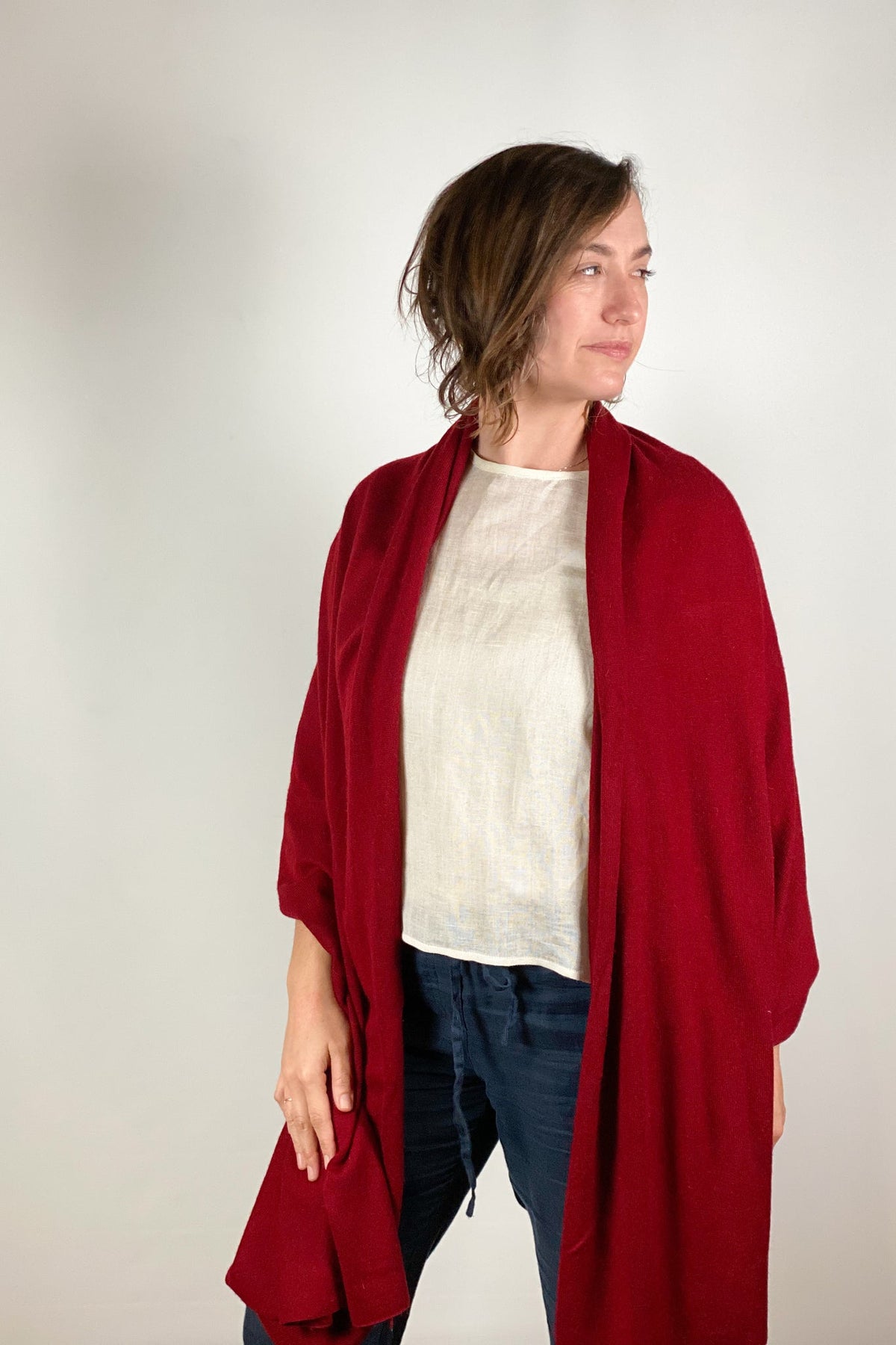 Solid cashmere scarf in a neutral tone with soft drape.