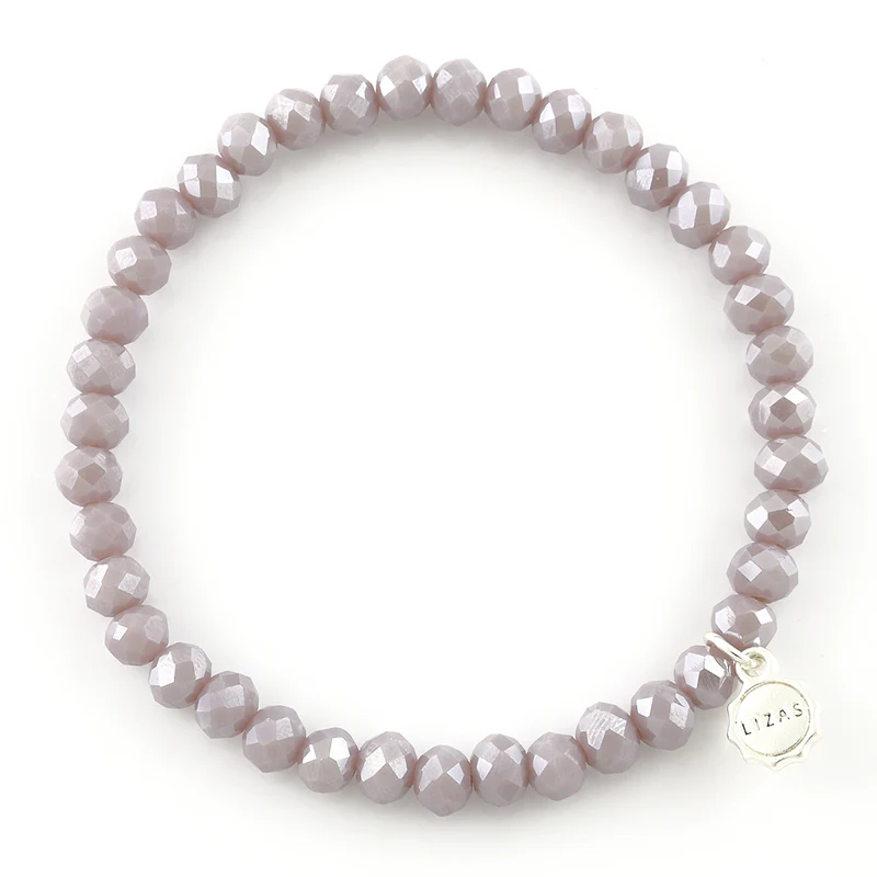 Lizas Quadro Big Bright Colours Bracelet featuring faceted light purple beads and a silver charm.