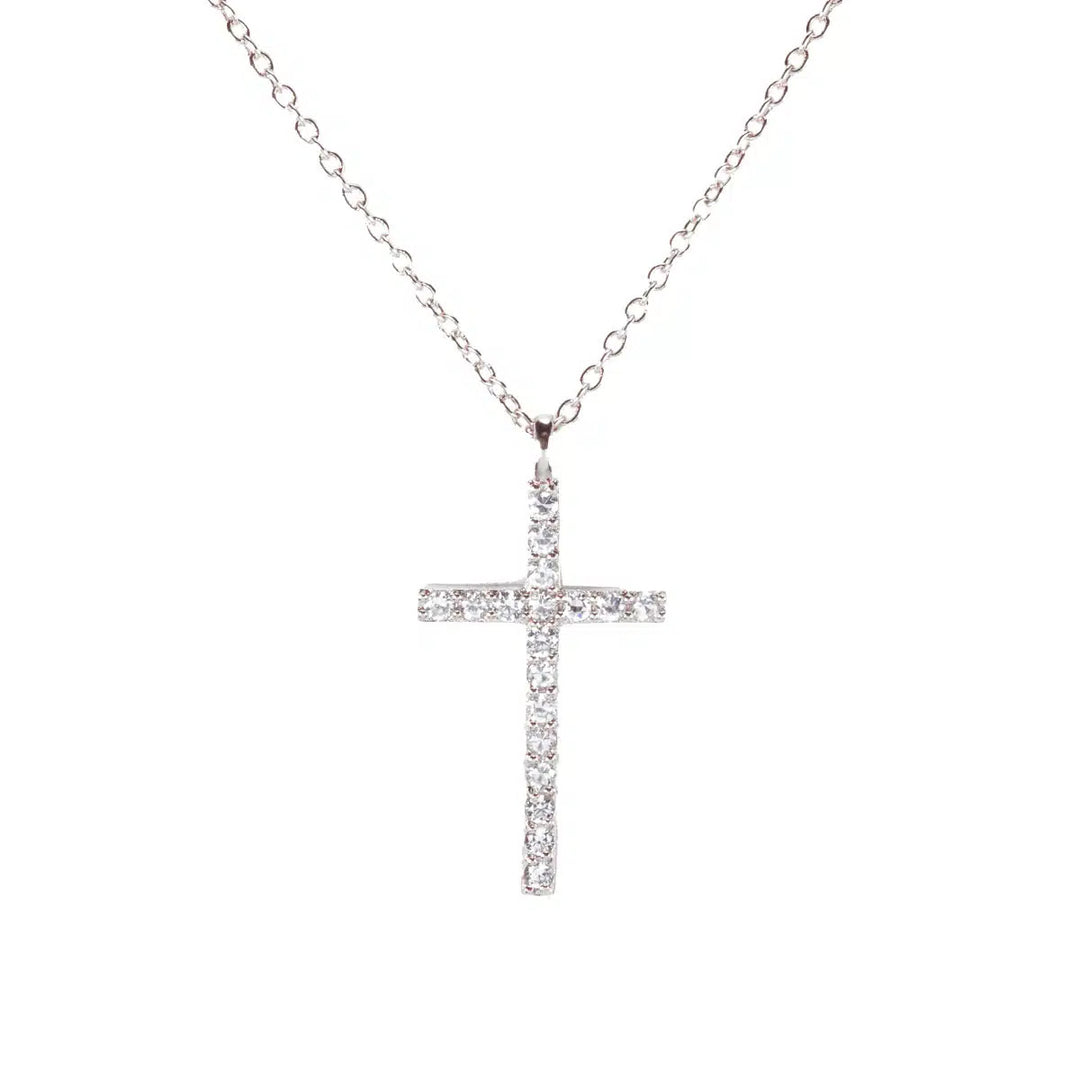 Silver cross necklace featuring a pendant set with sparkling clear stones on a delicate chain.
