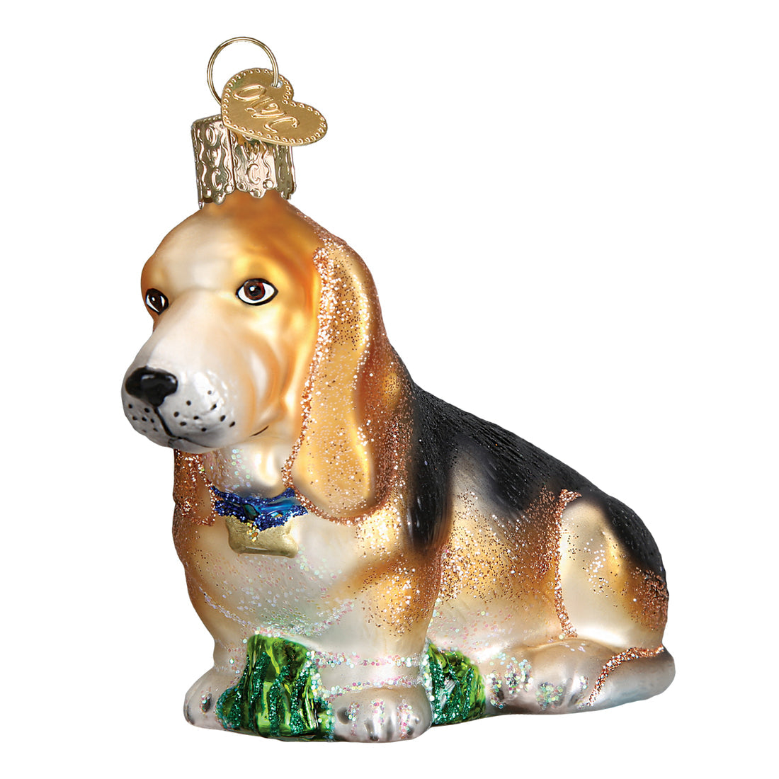 Glass Basset Hound Christmas ornament with floppy ears, a blue collar, and glitter accents.