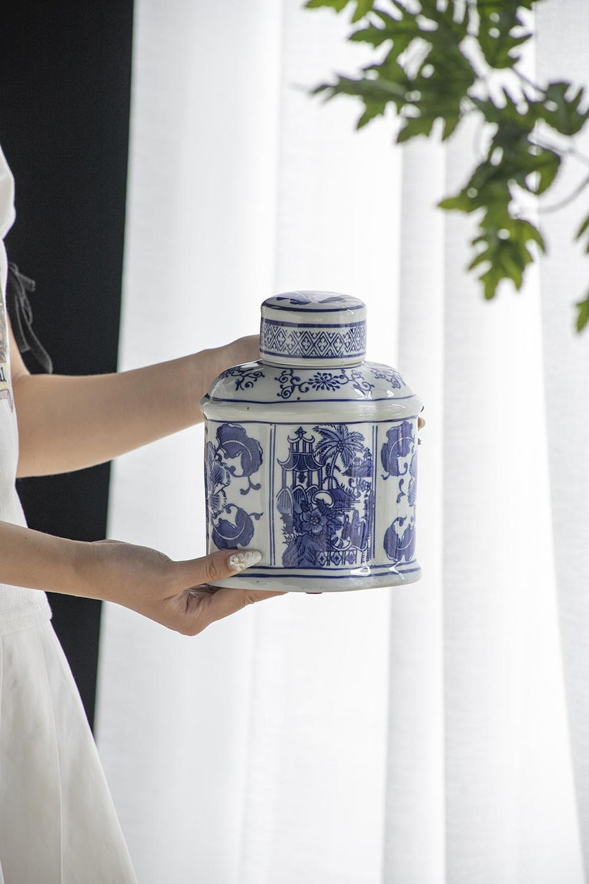 Oval porcelain jar in blue and white with a classic floral pattern.