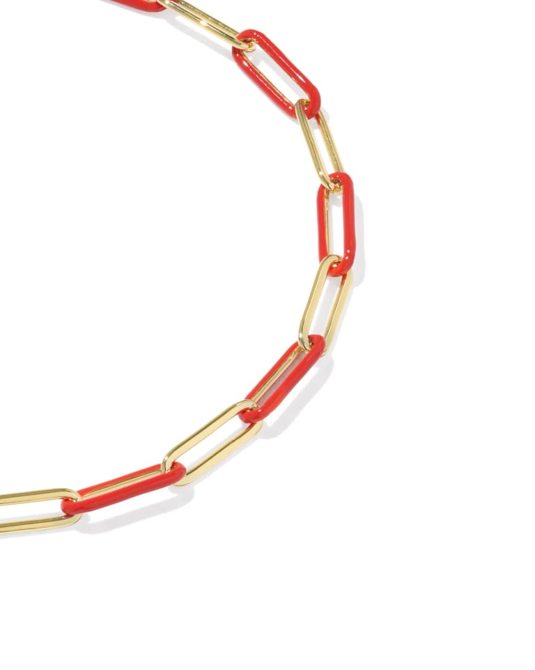 Courtney gold chain bracelet featuring alternating red enamel and polished gold paperclip links.