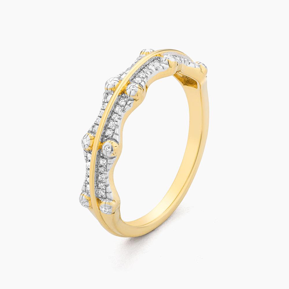 Silver crown-shaped statement ring with small diamonds set in a regal band.