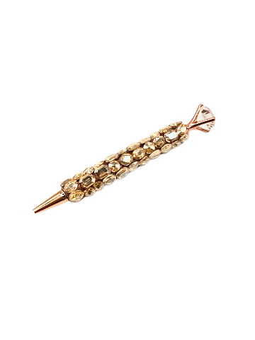 Rose gold crystal ink pen covered in champagne-colored gems with a large diamond-shaped topper.