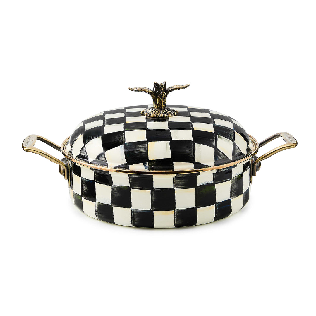 Black and white checkered enamel 5 quart casserole dish with brass handles and a bird-shaped knob.