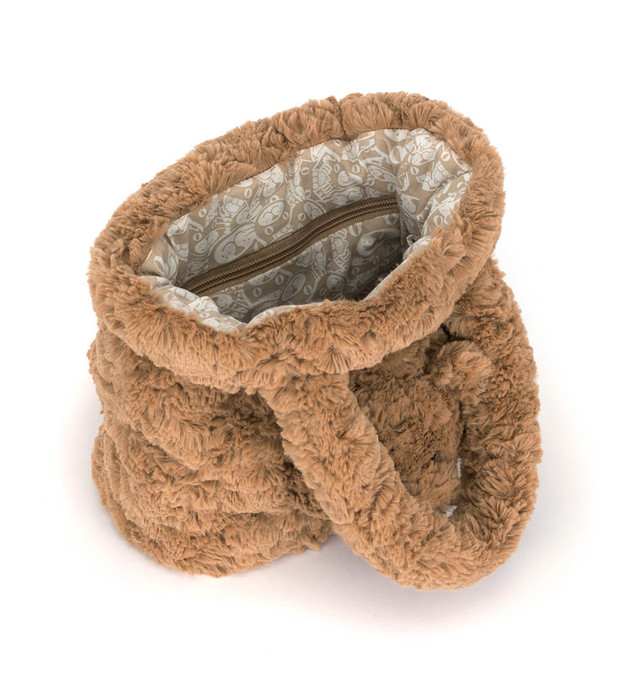 Interior view of the Bartholomew Bear Handbag showing the patterned lining and zippered pocket.
