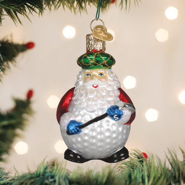 Red Santa golf ornament swinging a club with a hole-in-one on green background