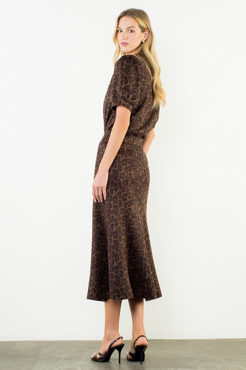 Woman wearing the Stella Suede Animal Print Top in brown leopard print with matching midi skirt.