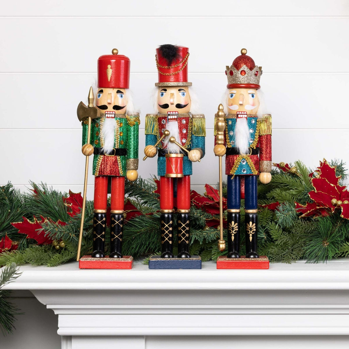 Wooden nutcracker with gold glitter glitz finish in a classic soldier silhouette standing on a base.