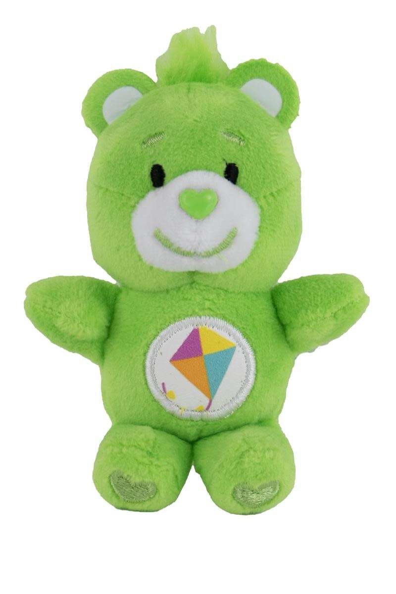 Small plush Care Bear with a yellow belly badge featuring the text Do Your Best.