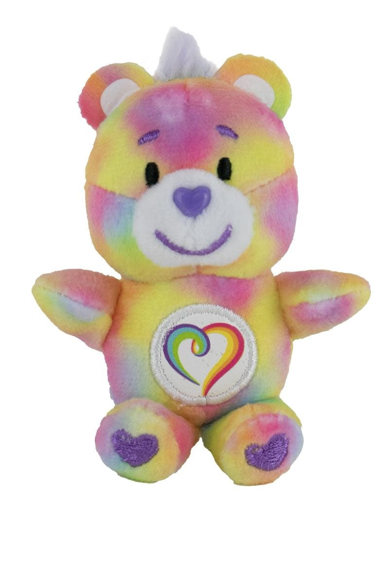 Small plush Care Bear named Togetherness in blue with a heart symbol on its chest.