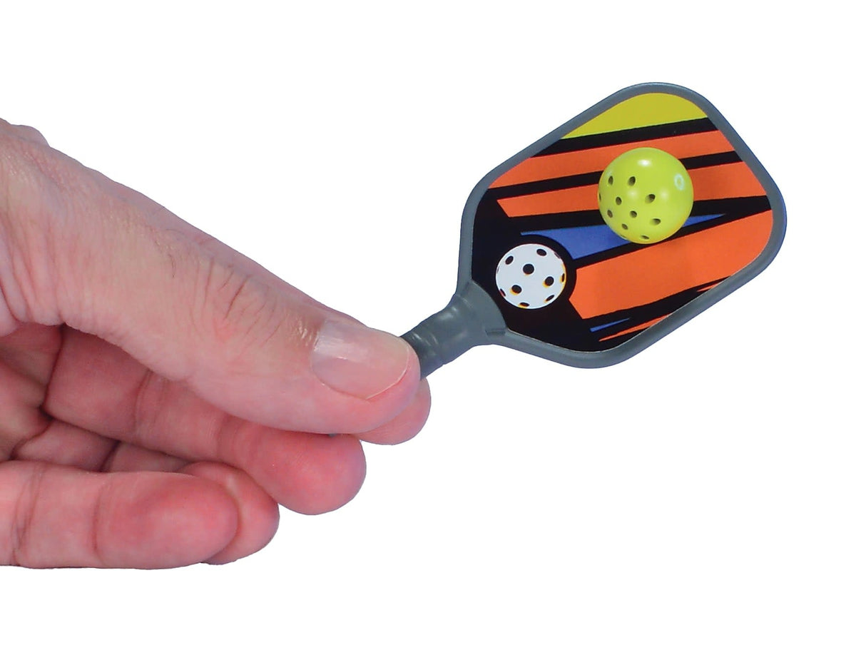 Keychain pickleball set with two paddles, balls, and a pocket-sized carrying case.