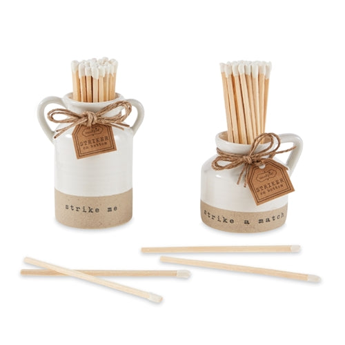 Tall stoneware match pot set in natural earth tone with smooth cylindrical silhouette.