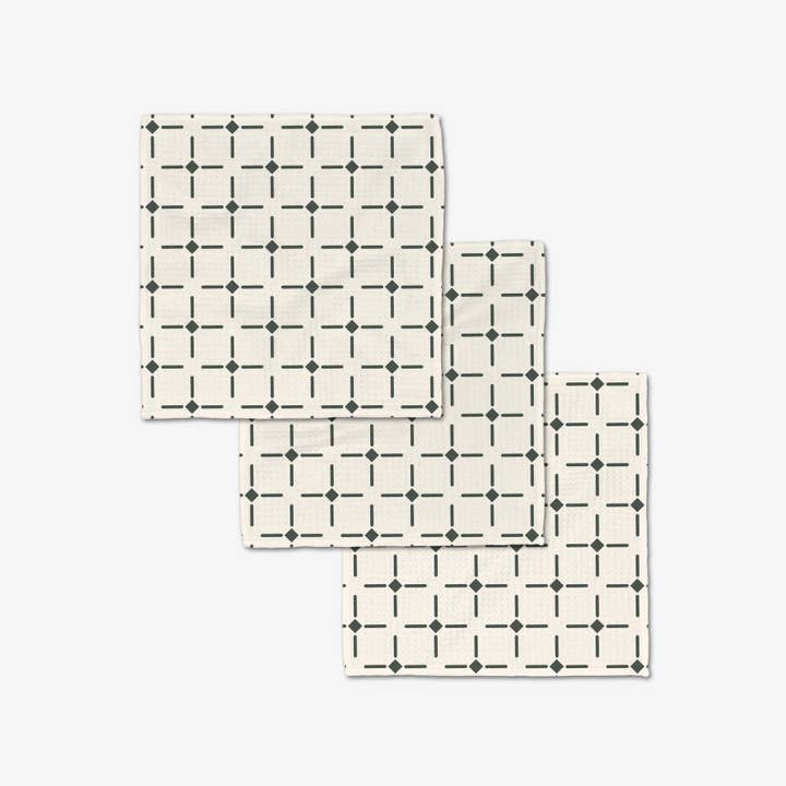 Set of white waffle weave washcloths with single-sided print designs.
