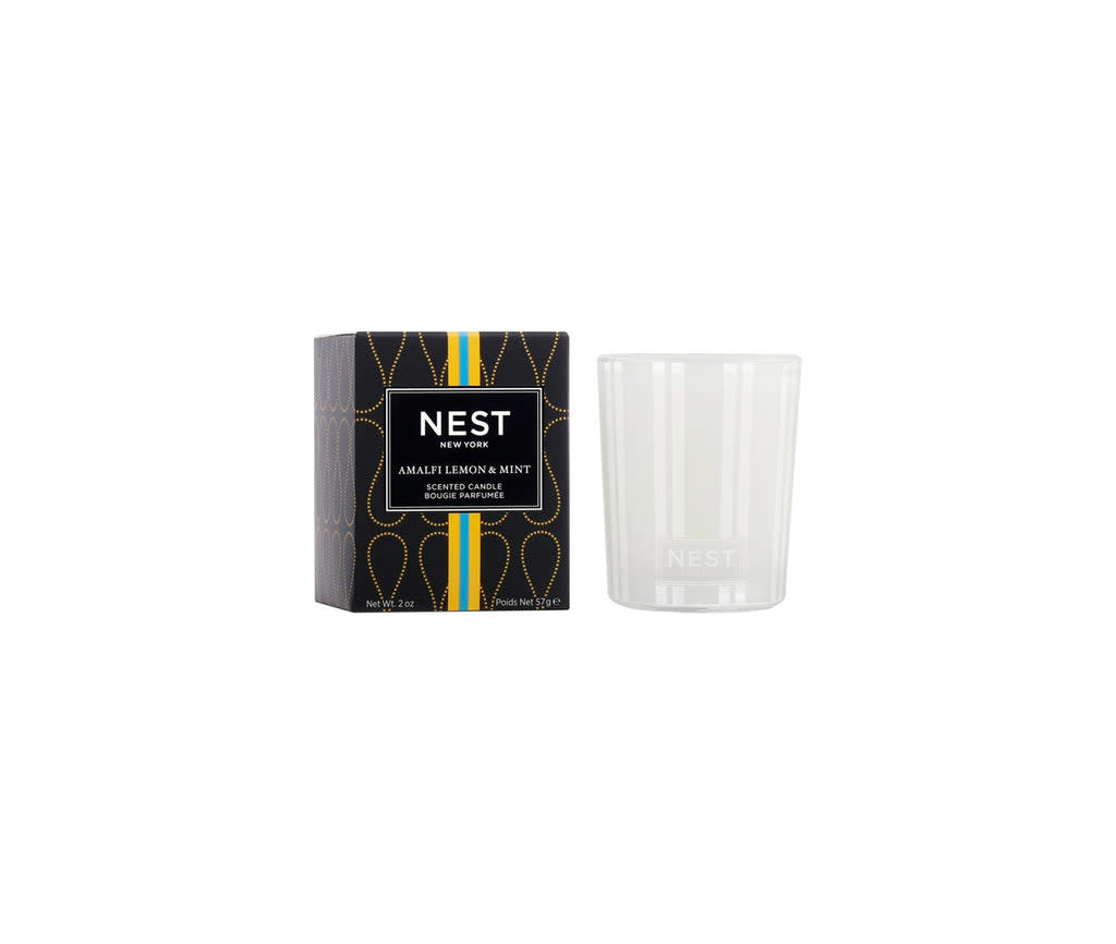 Nest Votive Candle in a clear glass holder with white wax.