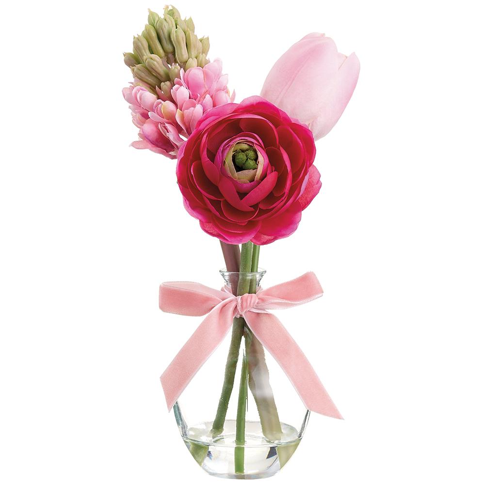 Pink Ranunculus/Tulip floral arrangement in a clear glass vase