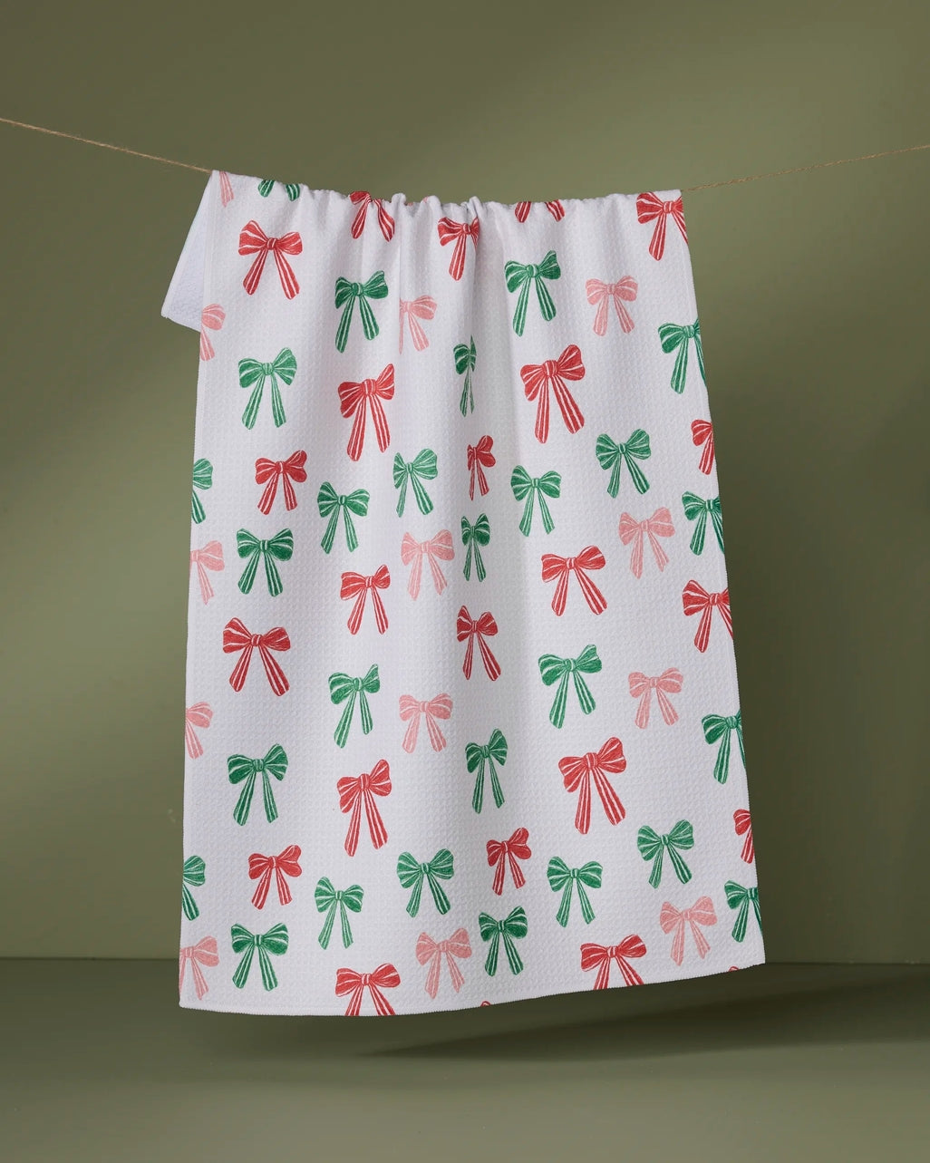 Recycled polyester waffle weave kitchen tea towel with single-sided holiday print.