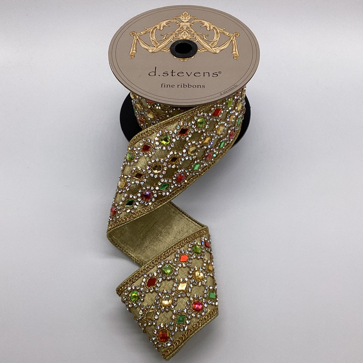 3-inch wide by 5-yard long metallic gold Royal Jewels ribbon with a colorful shimmering pattern.