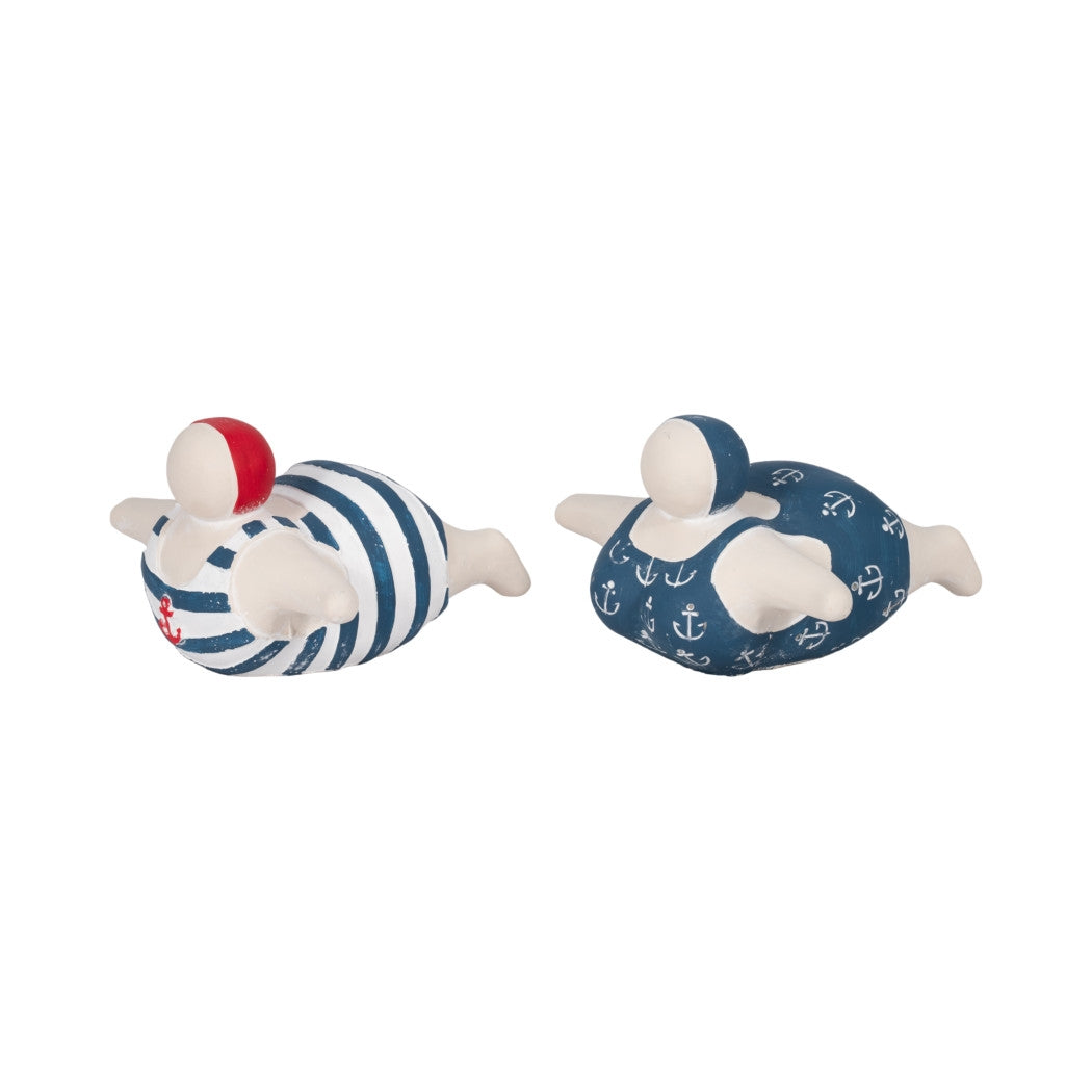 Two ceramic bathing beauty figurines in blue and white nautical swimwear with anchor details.
