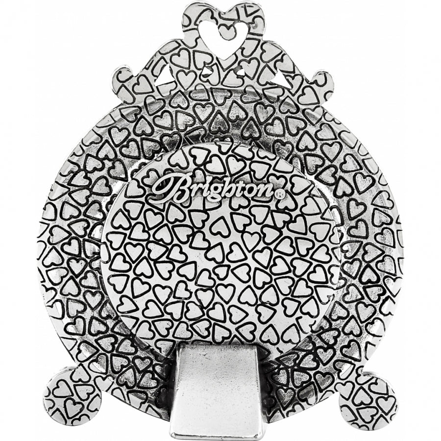 Silver plated Memphis etched clock with a one-inch face diameter.