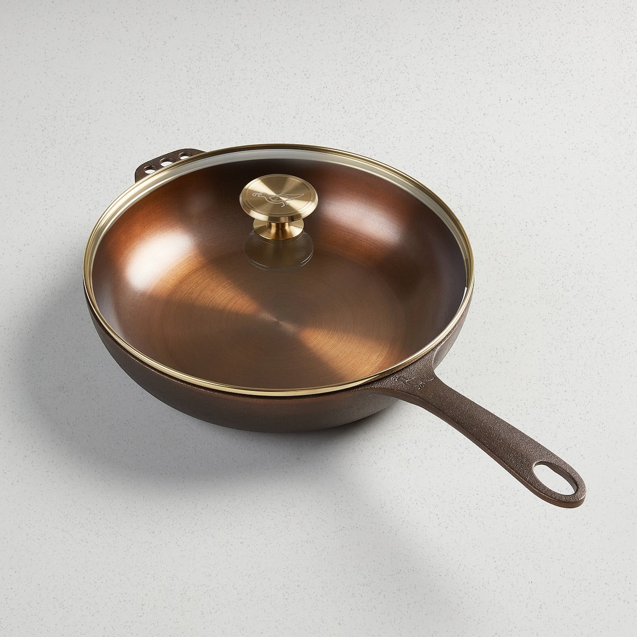 No. 11 Deep Skillet with a glass lid and gold-toned knob on a white surface.