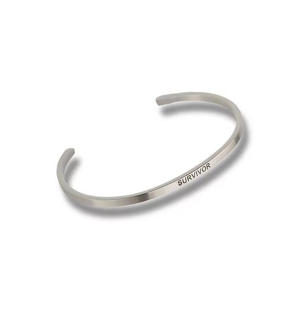 Silver-toned metal cuff bracelet engraved with the word SURVIVOR in a simple sans-serif font.