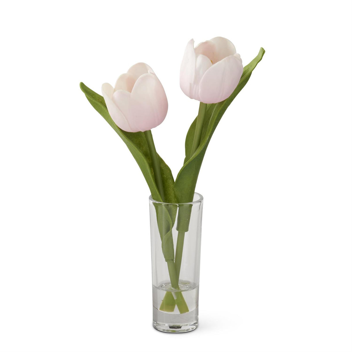 Glass vase holding double tulip arrangement in faux green leaves with white petals.